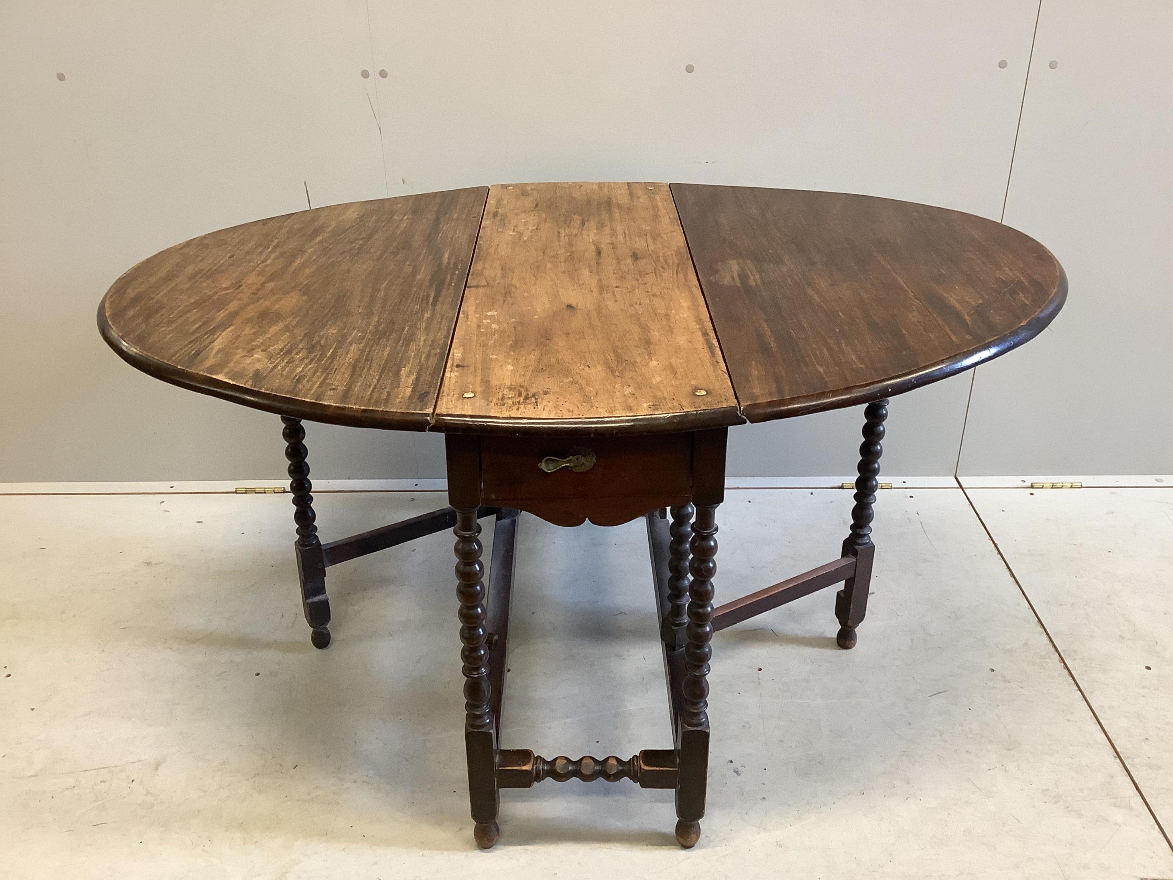 A 17th century style mahogany gate leg table, width 97cm, depth 37cm, height 72cm. Condition - fair